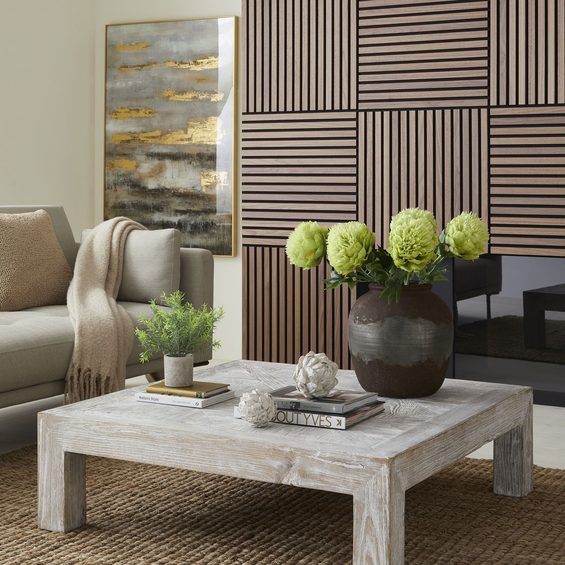 Living room with a wooden coffee table, sofa, and decorative elements.