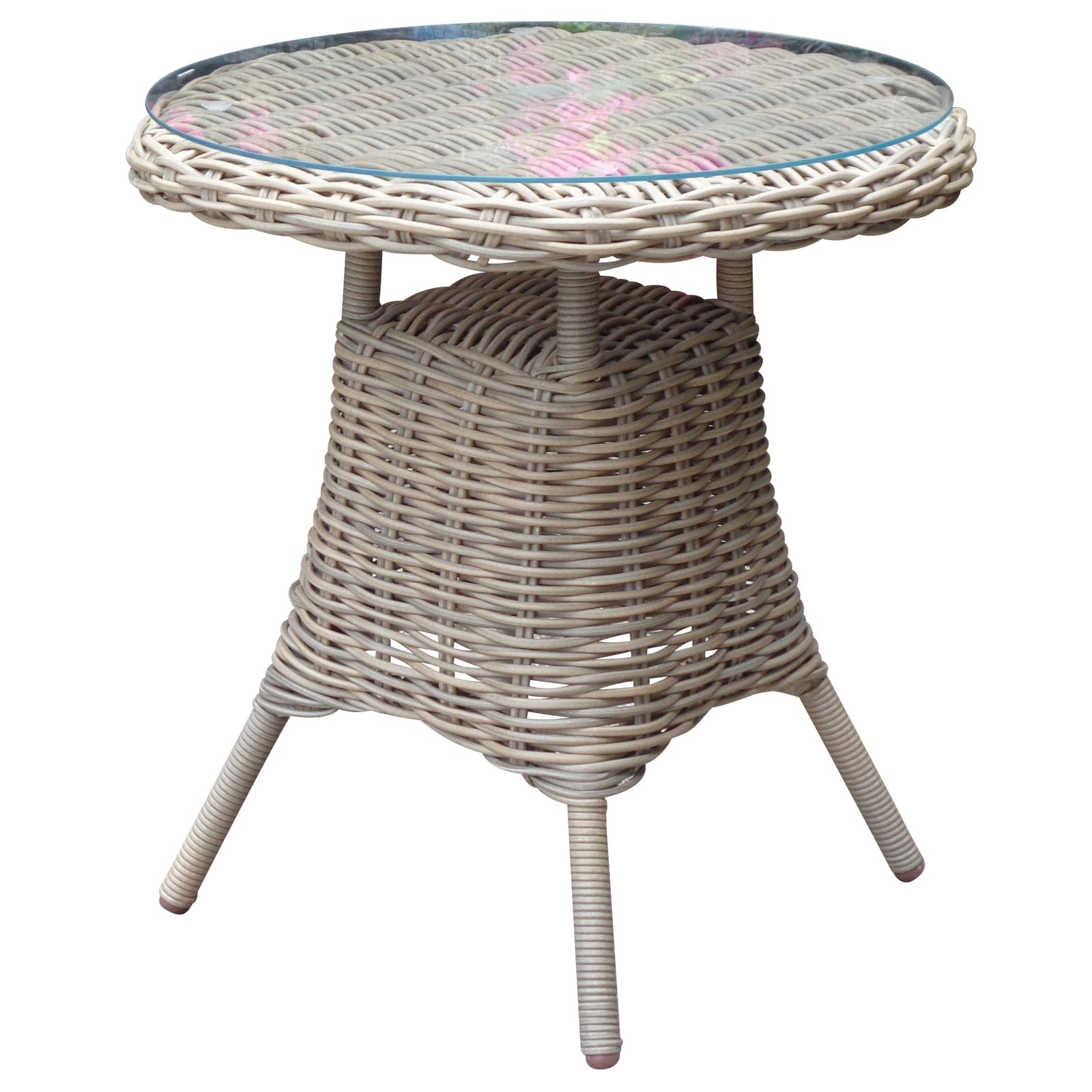 Wicker side table with a glass top on a white background