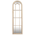 Arched window-style mirror with wooden frame on a white background