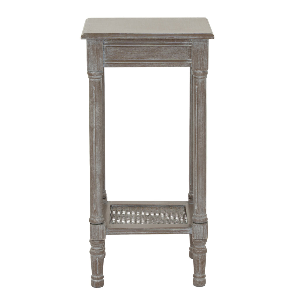 Wooden side table with a wicker shelf on a white background