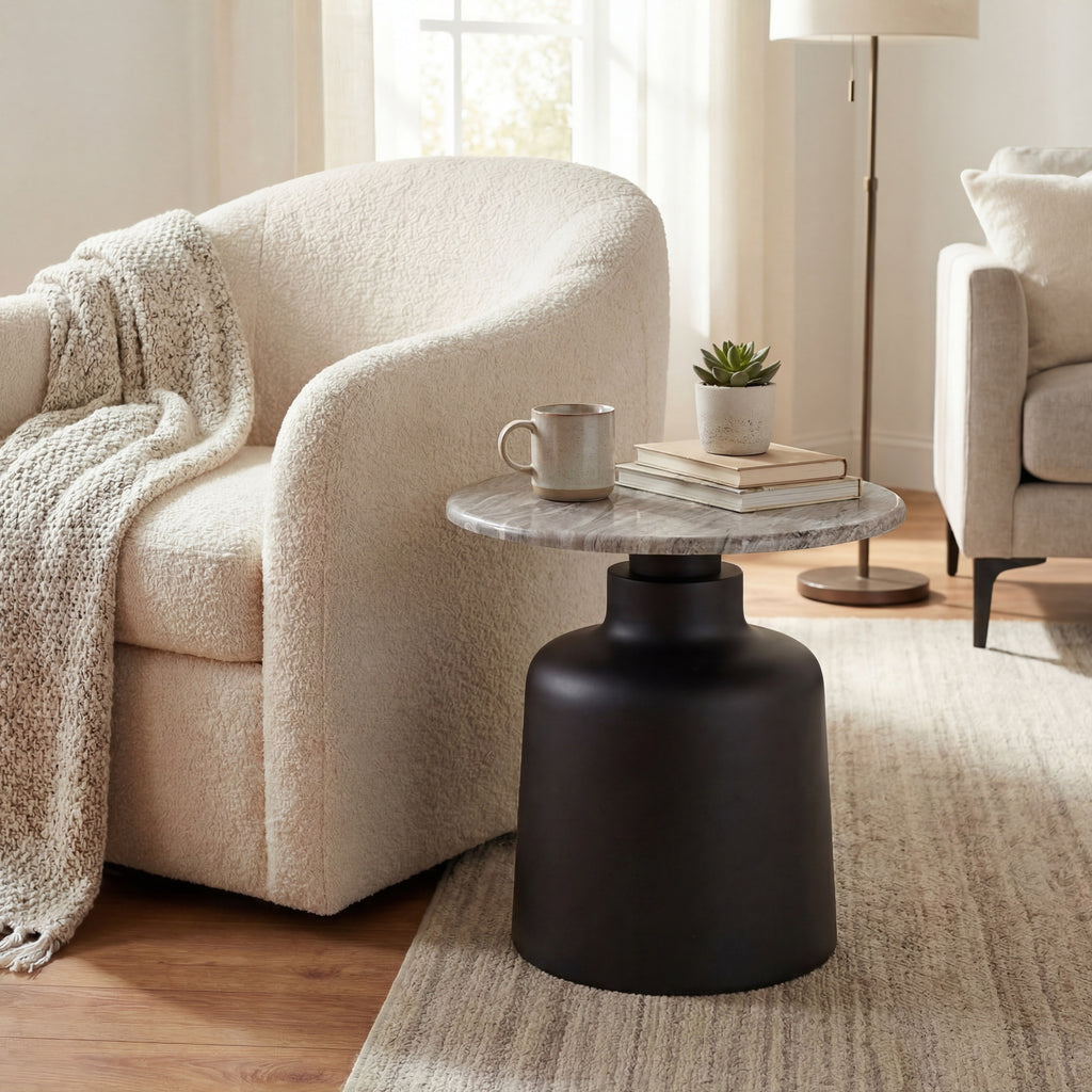 Living room with a beige armchair, black side table, and marble top