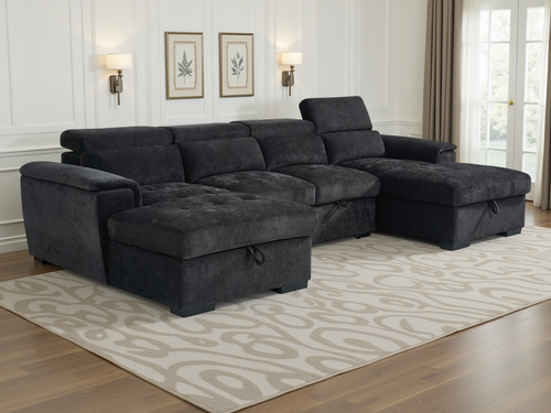 Gray sectional sofa in a living room setting with a rug and wall decor.