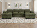 Green sectional sofa in a living room with decorative elements.