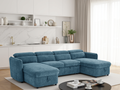 Blue sectional sofa in a modern living room with white walls and decor.