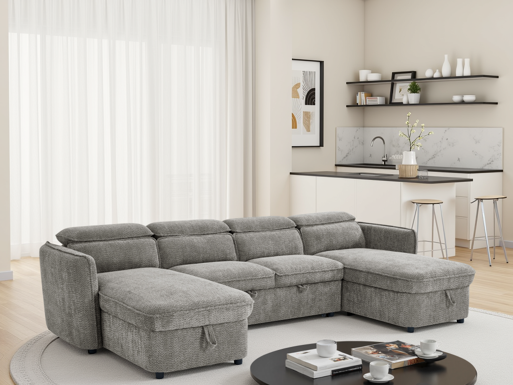 Gray sectional sofa in a living room with a kitchen in the background