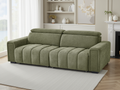 Green sofa in a living room with a fireplace and bookshelf.