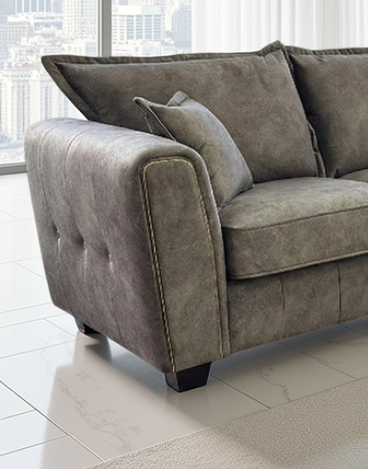 Gray sofa in a room with large windows and cityscape view